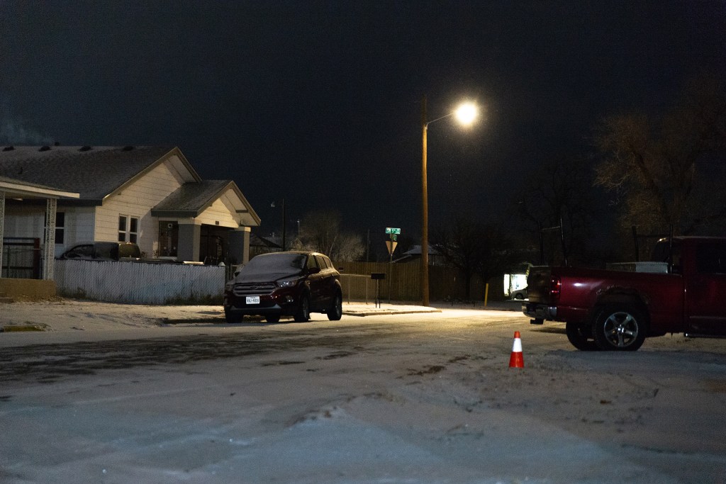 Snow began to accumulate on neighborhood streets in Amarillo on Friday evening.