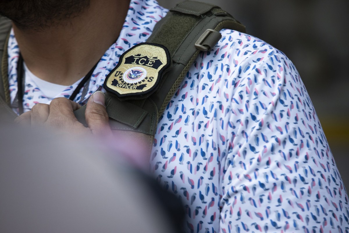 A U.S. Immigration and Customs Enforcement agent outside of the J.J. Pickle Federal Building in downtown Austin on April 1, 2025.