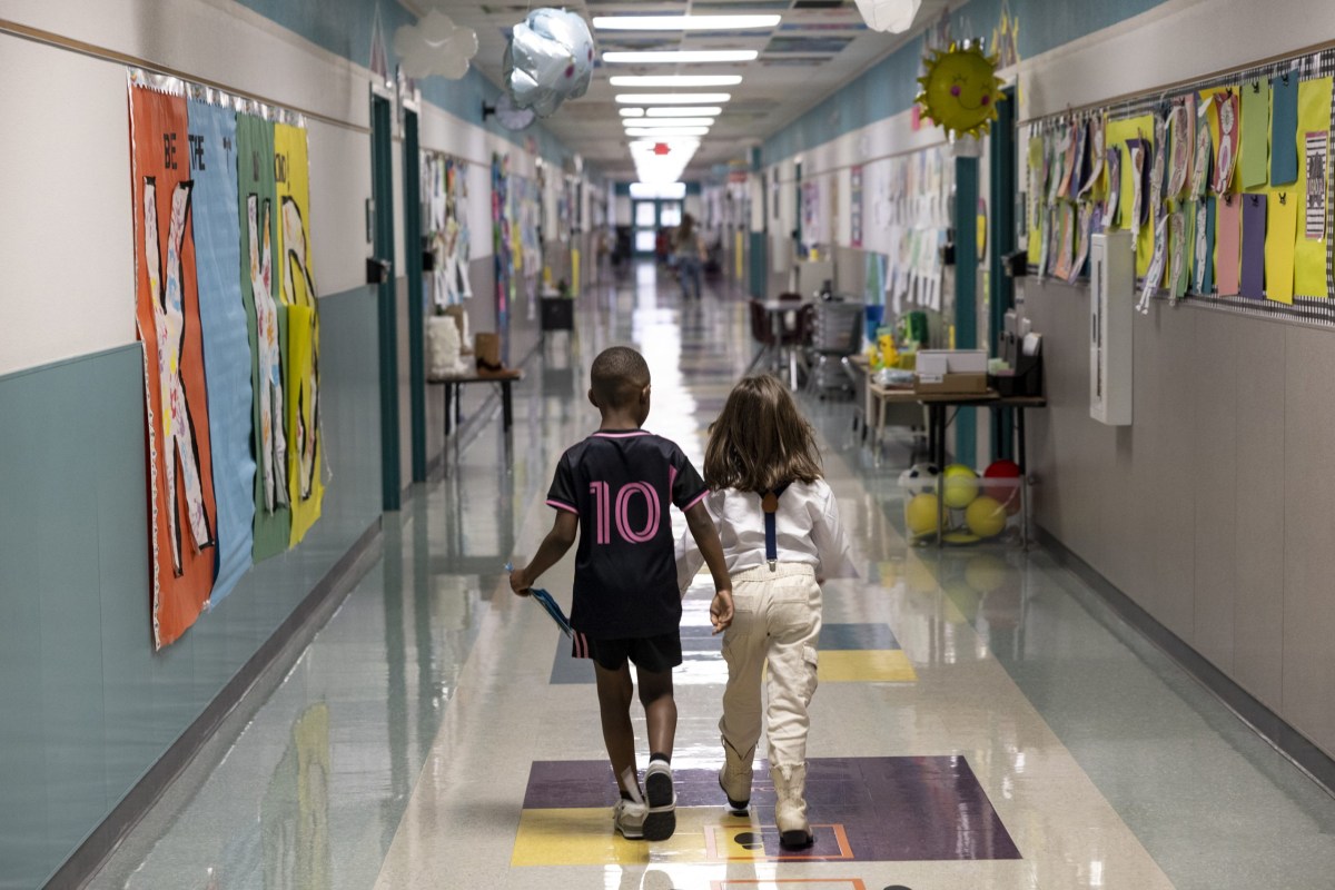 Children walk down a hall at Kennedy-Powell Elementary in Temple on April 17, 2025.