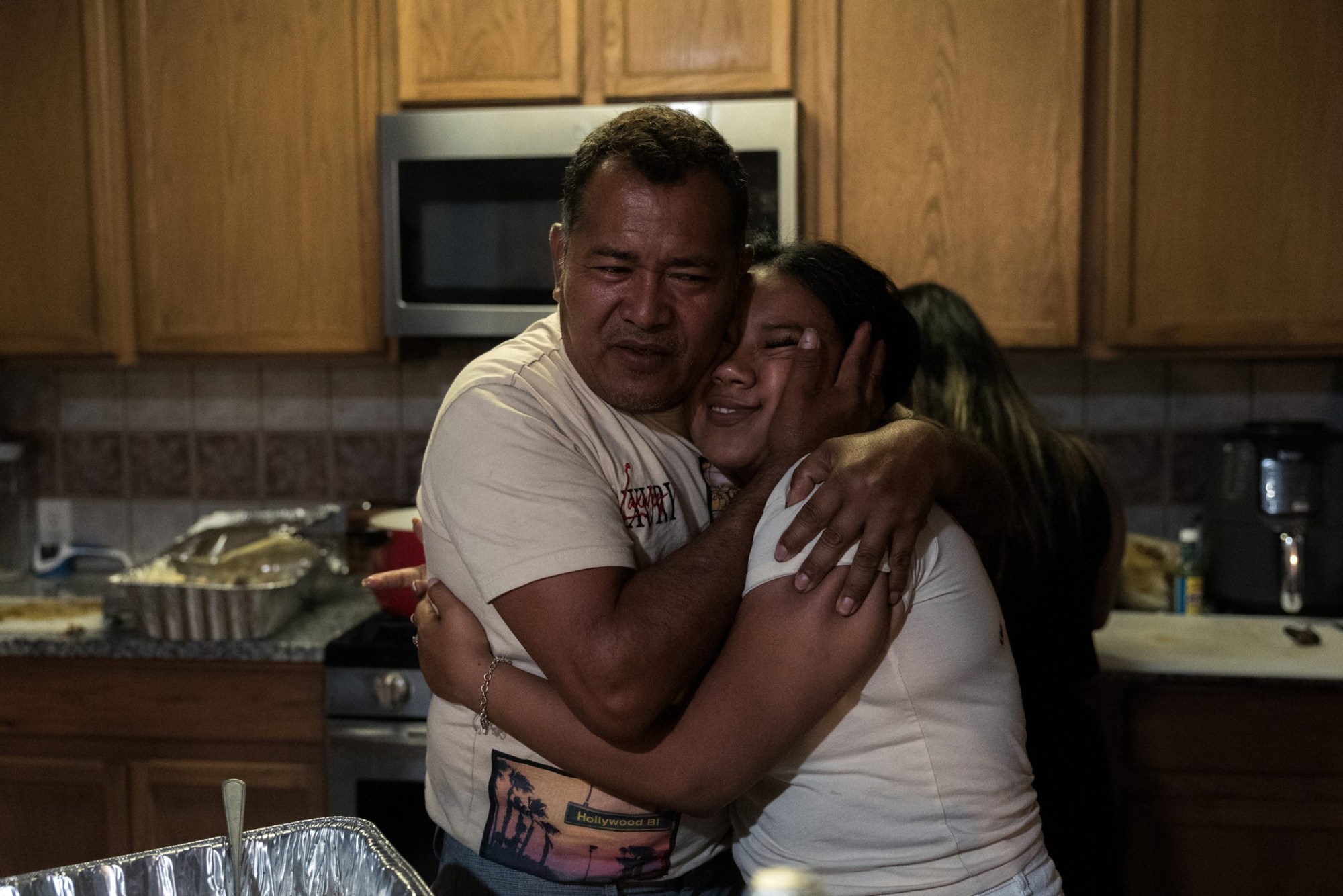 José hugs Lisbet, his eldest daughter, at her birthday celebration on May 24, 2025.