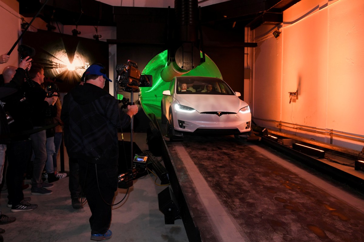 Elon Musk, co-founder and chief executive officer of Tesla Inc., arrives in a modified Tesla Model X electric vehicle during an unveiling event for the Boring Co. Hawthorne test tunnel in Hawthorne, California, on Dec. 18, 2018.
