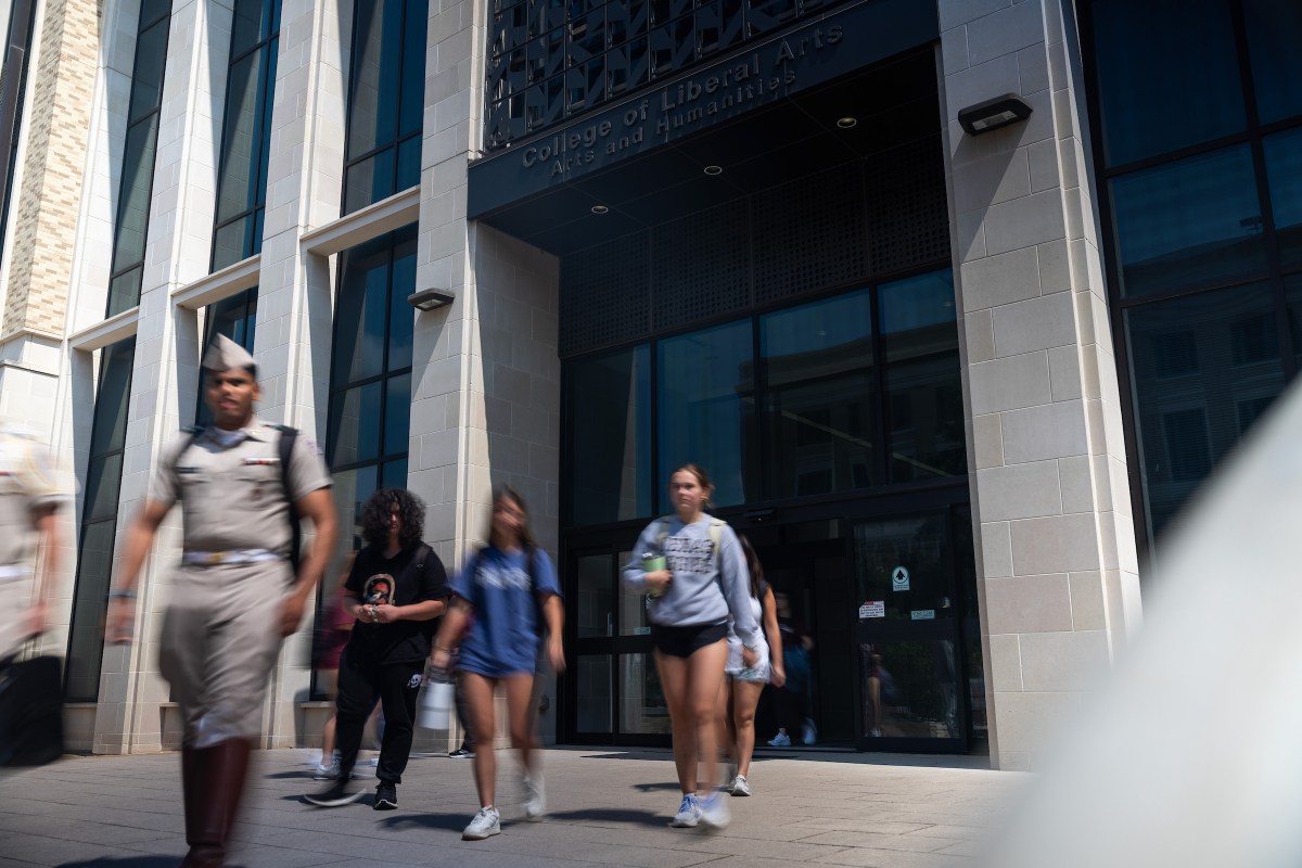 Students walk out of the College of Liberal Arts and Social Sciences at Texas A&M University on Sept. 18, 2025, in College Station.