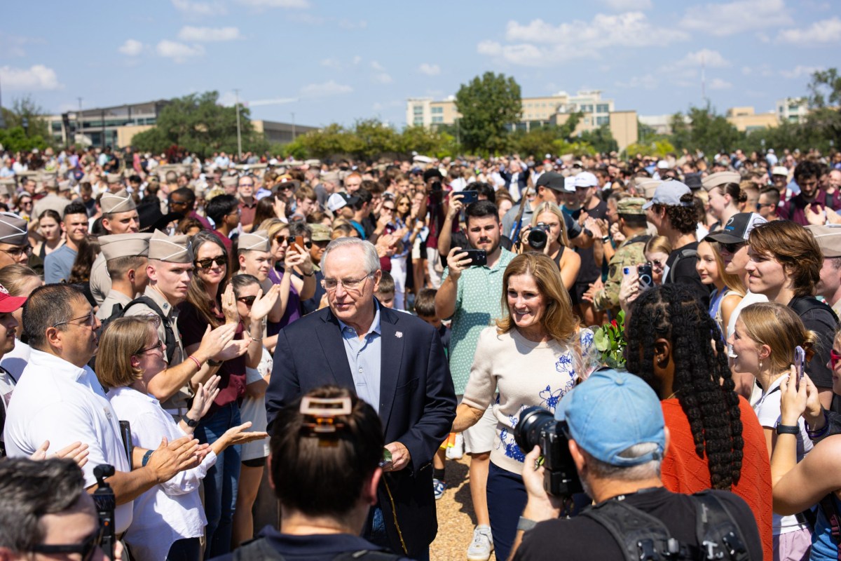 President Mark A. Welsh III and his wife Betty are greeted by A&M faculty and students as he leaves campus after resigning on Sept. 19, 2025. The university system paid Welsh $3.5 million as part of his separation agreement.