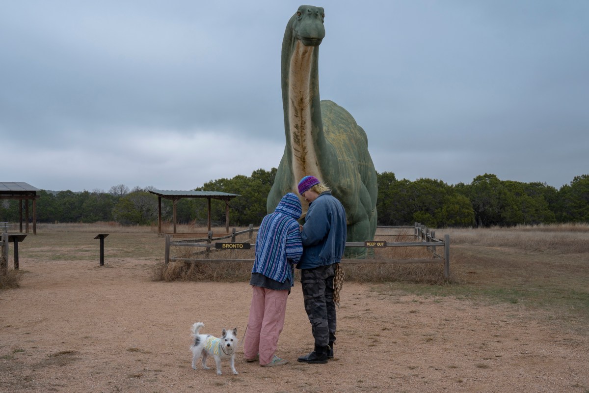 Nicholas Hanson and Haley Write of Austin with their dog Beans at Dinosaur Valley State Park on Nov. 7, 2025. A proposed transmission line could be visible from the park.