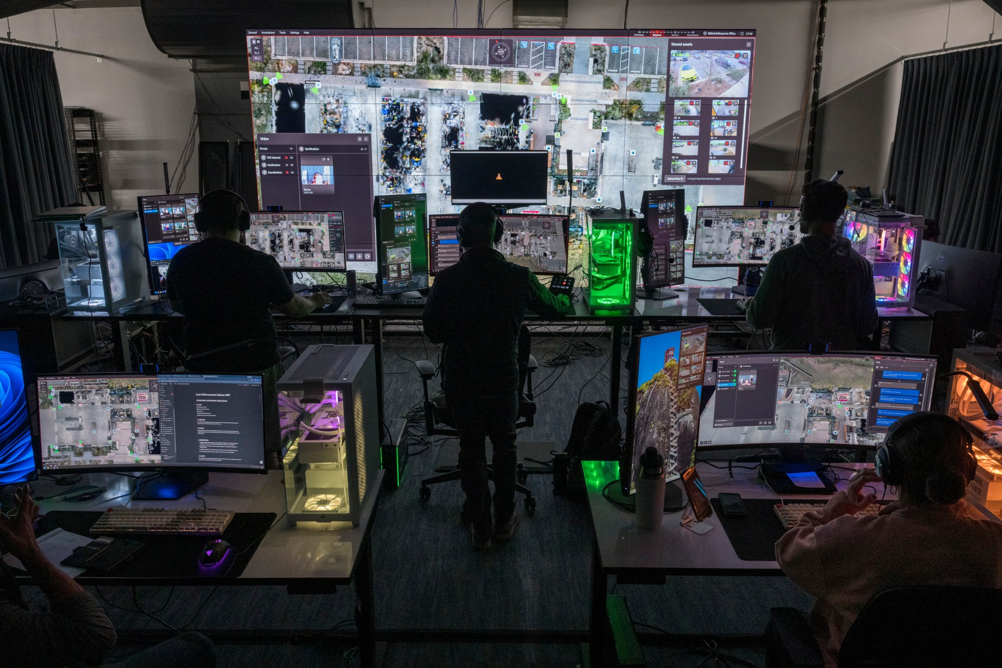 Members of Campus Guardian Angel’s Tactical Operations Command (TOC) team monitor video feeds and other information while conducting a virtual emergency exercise at the company’s headquarters in Austin on Tuesday, Jan. 13, 2026. Guardian Angel has constructed a TOC center featuring various stations for team members and a large screen to monitor live data from potential emergencies, similar to governmental operations centers.