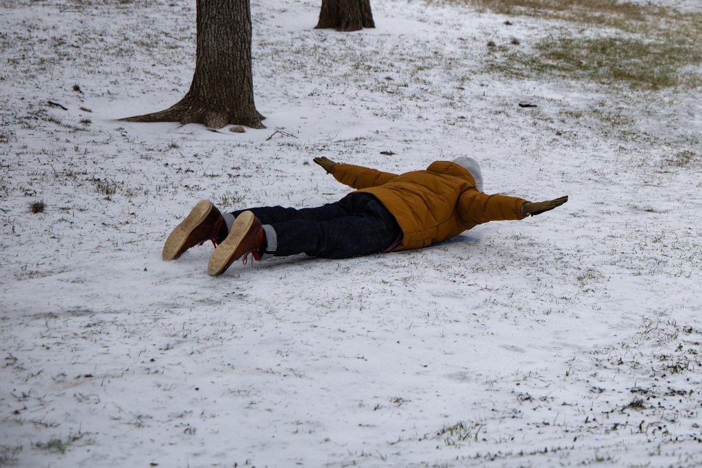 Nick Wagner glided down an icy slope at Ricky Guerrero Park in Austin on Sunday afternoon.