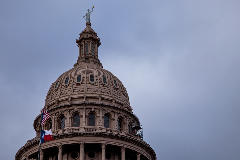 By Sunday afternoon in Austin, the precipitation had passed, but a stiff north wind still whipped the flags flying at the Capitol.
