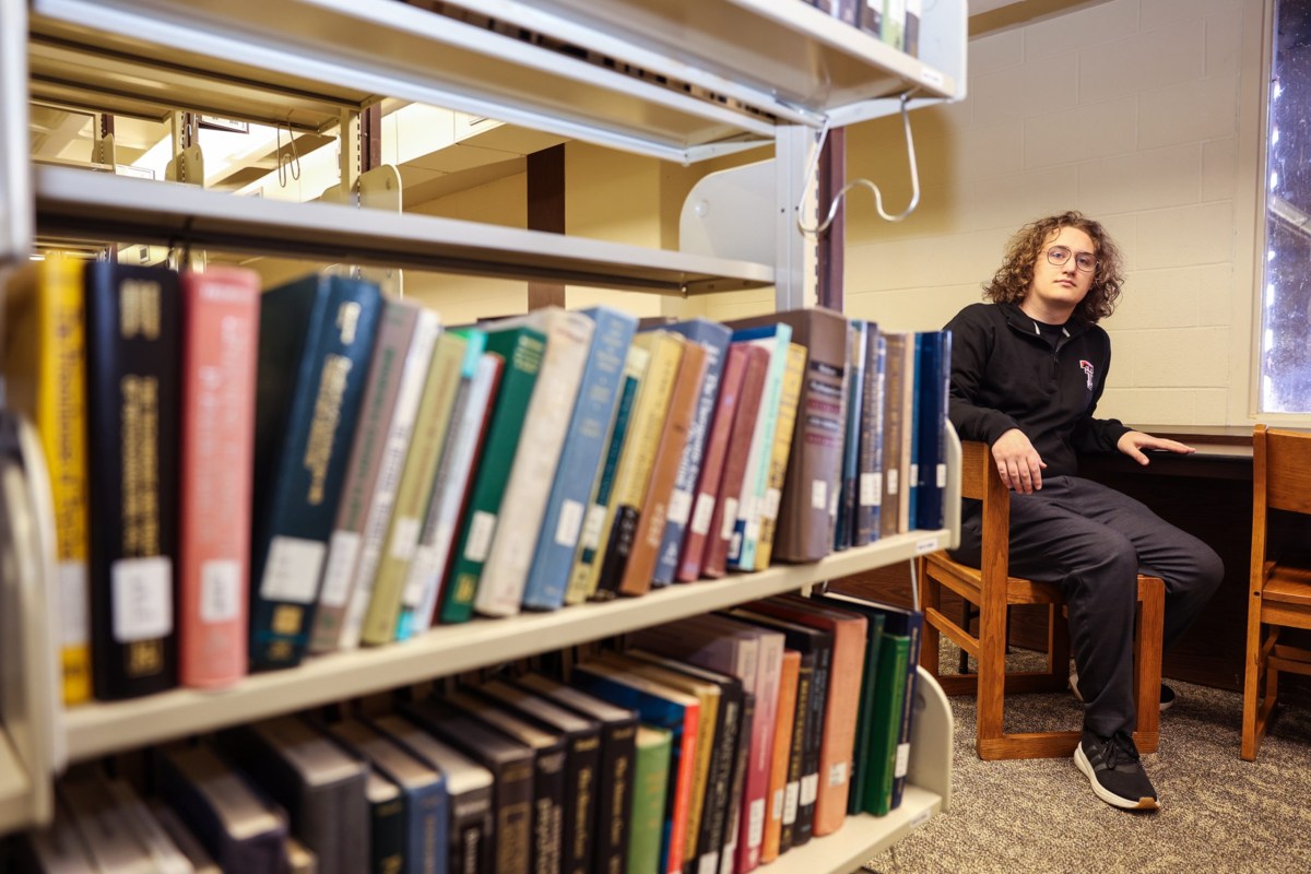 Henry Carter, a Texas Tech student history major with a minor in women’s and gender studies, inside the library on Jan. 29, 2025 in Lubbock.