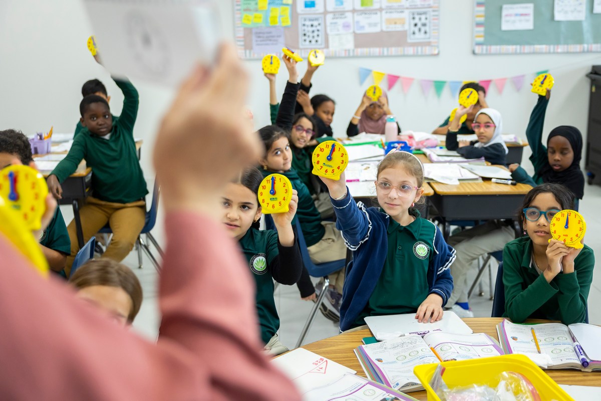 Students translate digital time to analog clocks at Iman Academy in southwest Houston on Wednesday, March 4, 2026.
