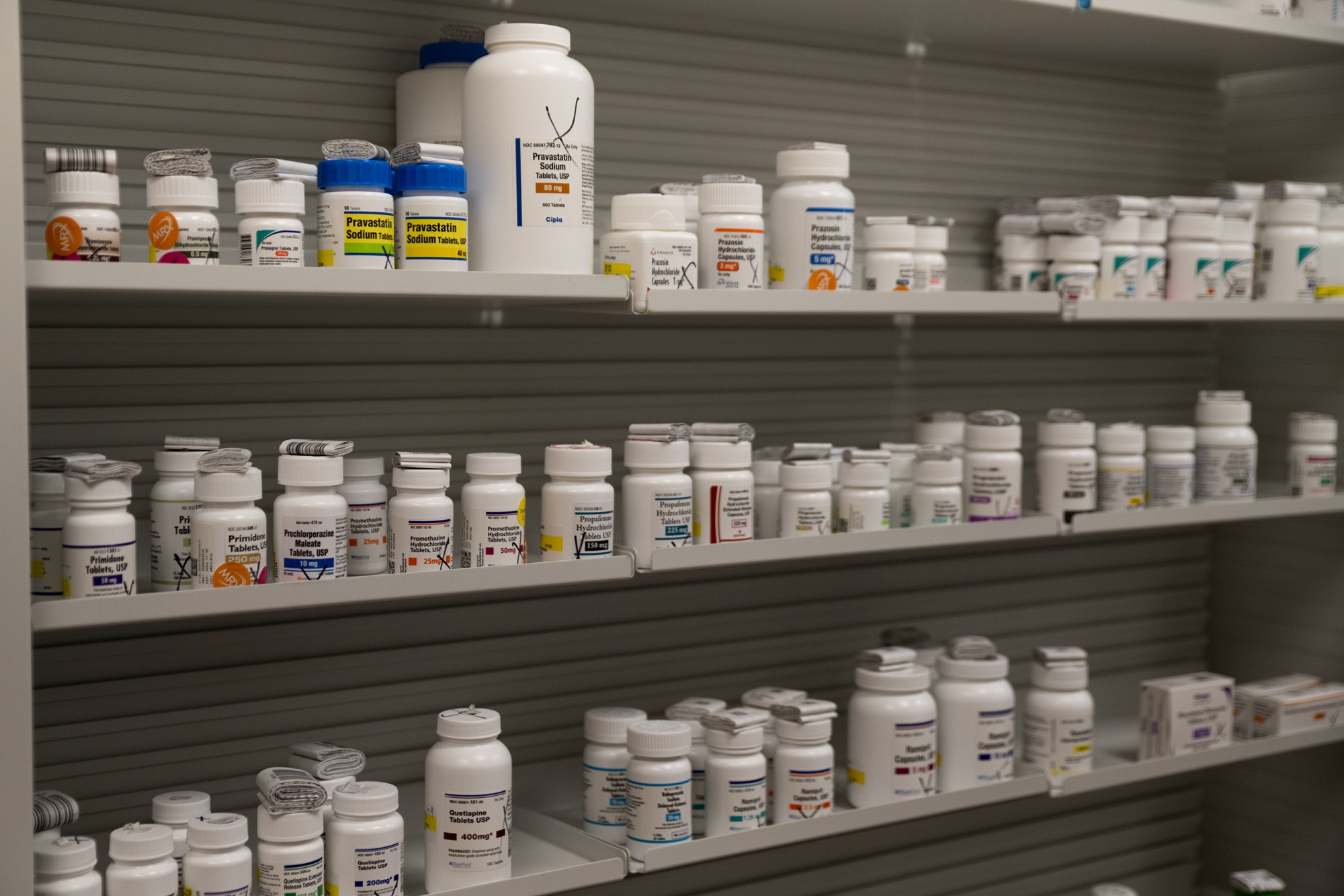 A collection of stock bottles, used to fill individual prescriptions, on shelves at Hyland's Pharmacy in Wheeler on March 21, 2026.