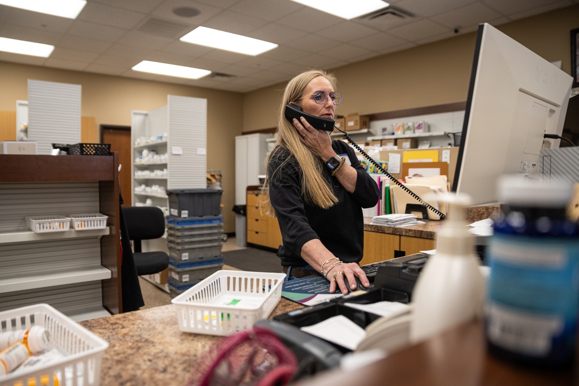 Crystal McEntire answers the phone at Hyland's Pharmacy in Wheeler while looking up prescription information on March 21, 2026.