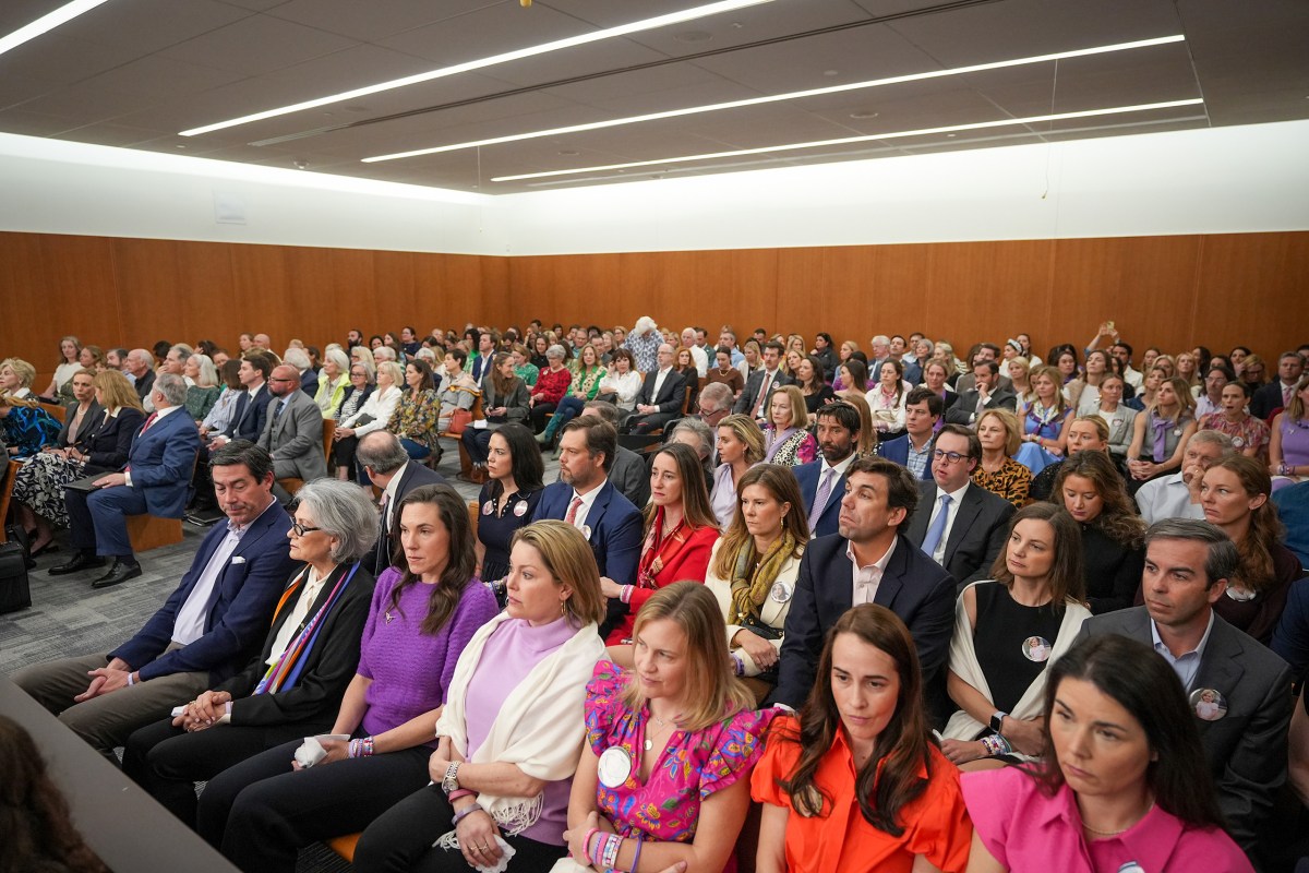 Spectators, including family members of children who died at Camp Mystic, wait for the start of a hearing on a temporary restraining order at the Travis County Courthouse in Austin on March 4, 2026.