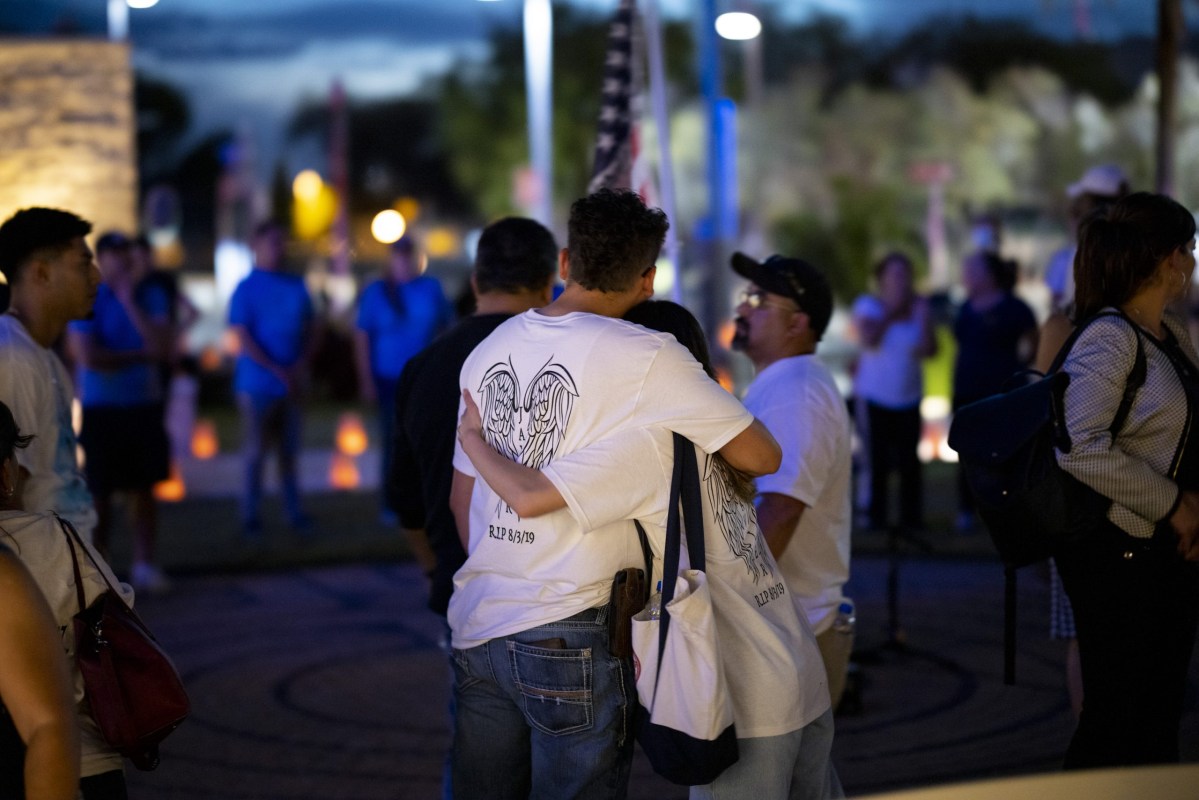 The family of Javier Amir Rodriguez, a victim of the El Paso Walmart shooting, at a 2022 memorial service at the El Paso County Healing Garden, on the third anniversary of the shooting that left 23 people dead.