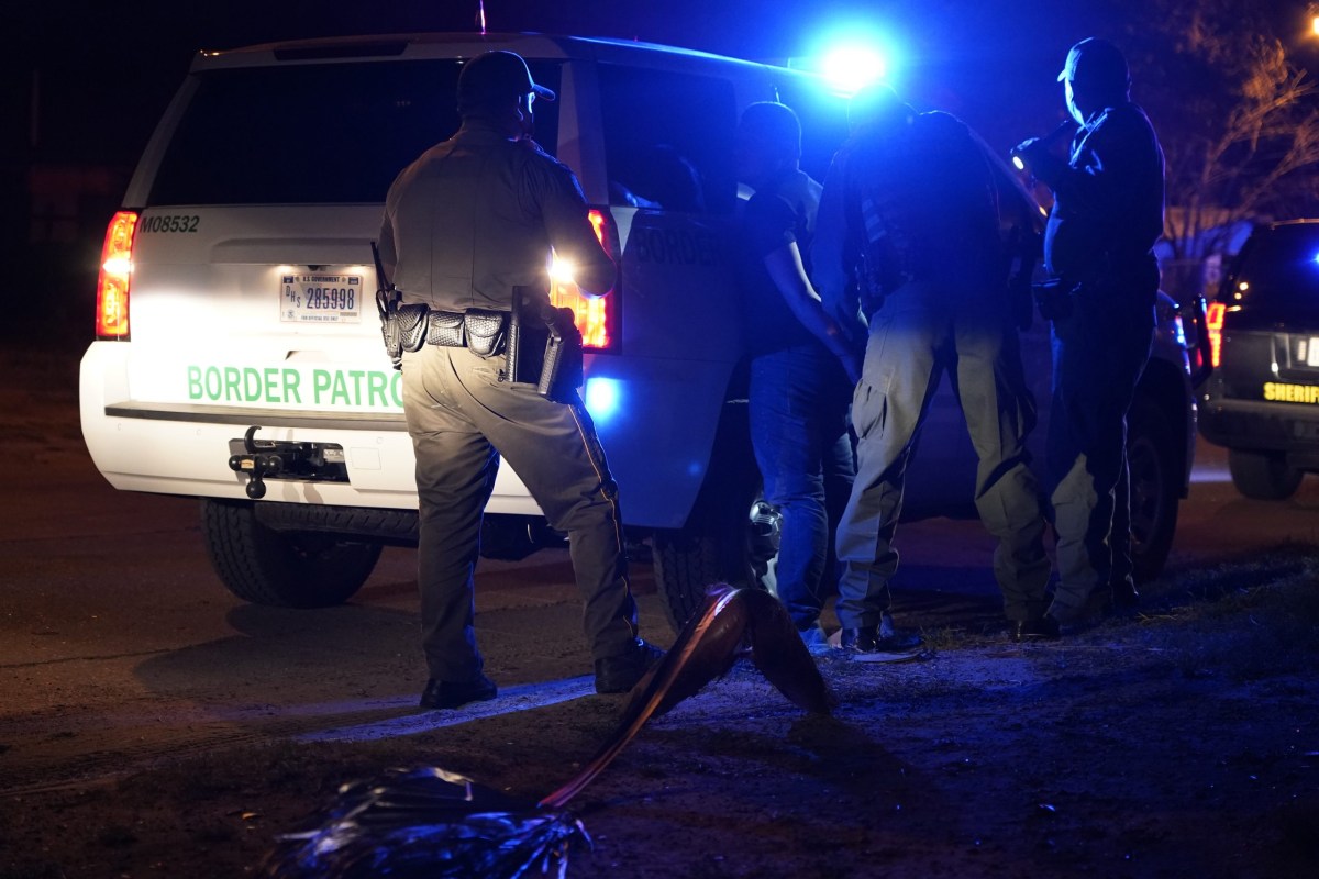 Webb County Sheriff and Border Patrol agents detain an individual in February 2021. A Senate bill would require certain Texas sheriffs to enter into agreements with U.S. Immigration and Customs Enforcement to help enforce immigration laws.