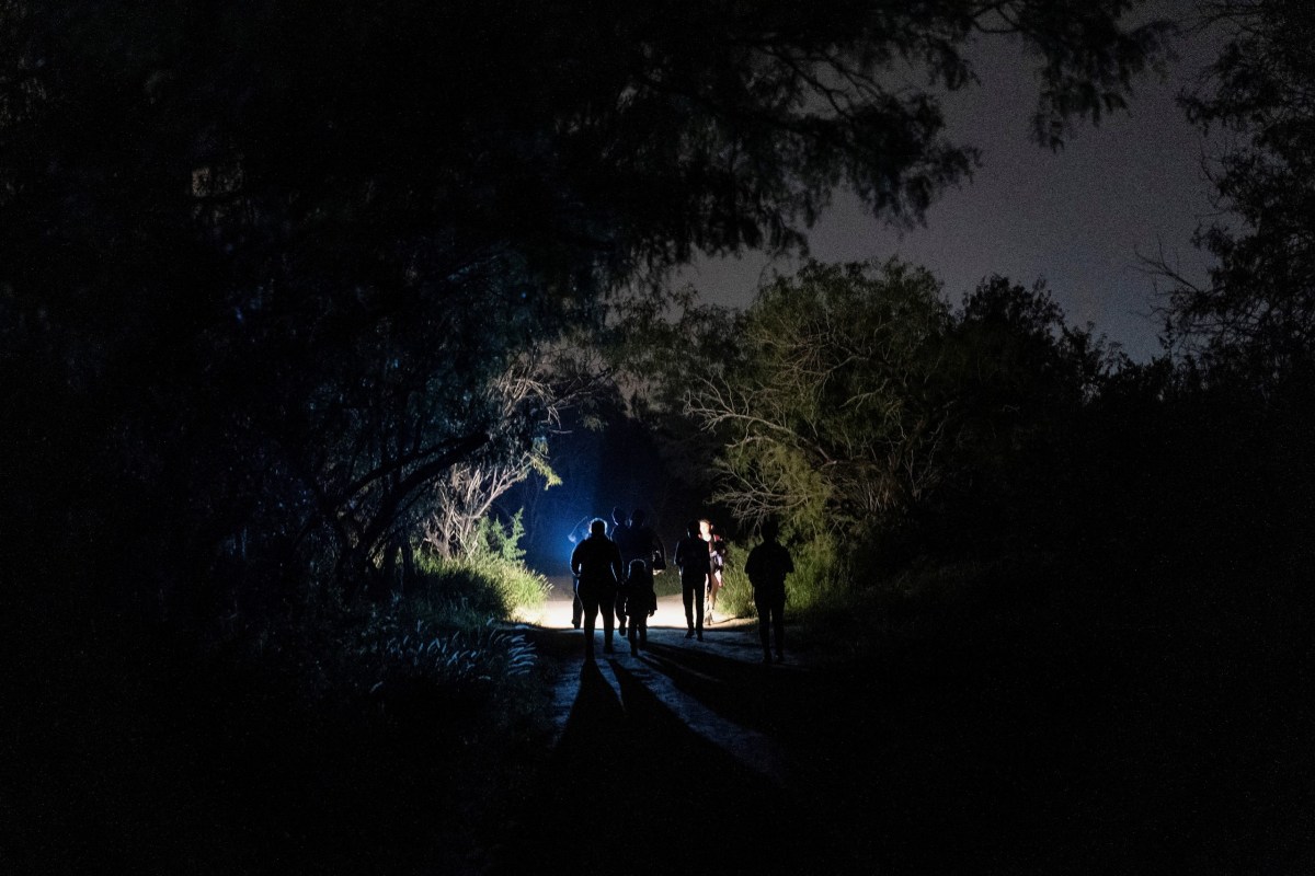 Asylum-seeking migrant families walked to turn themselves into the U.S. Border Patrol after crossing the Rio Grande at Starr County on June 9.