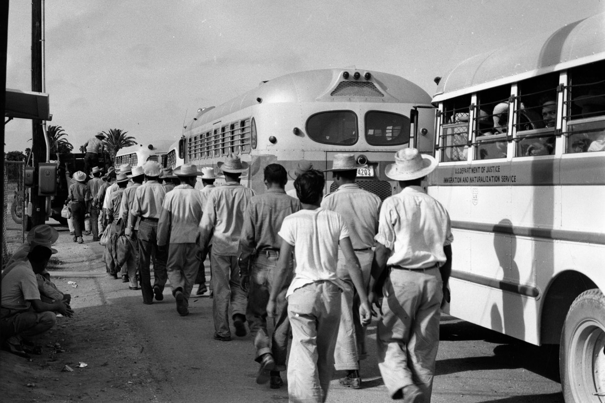 Mexican workers board deportation buses at a McAllen detention center in the early 1950.